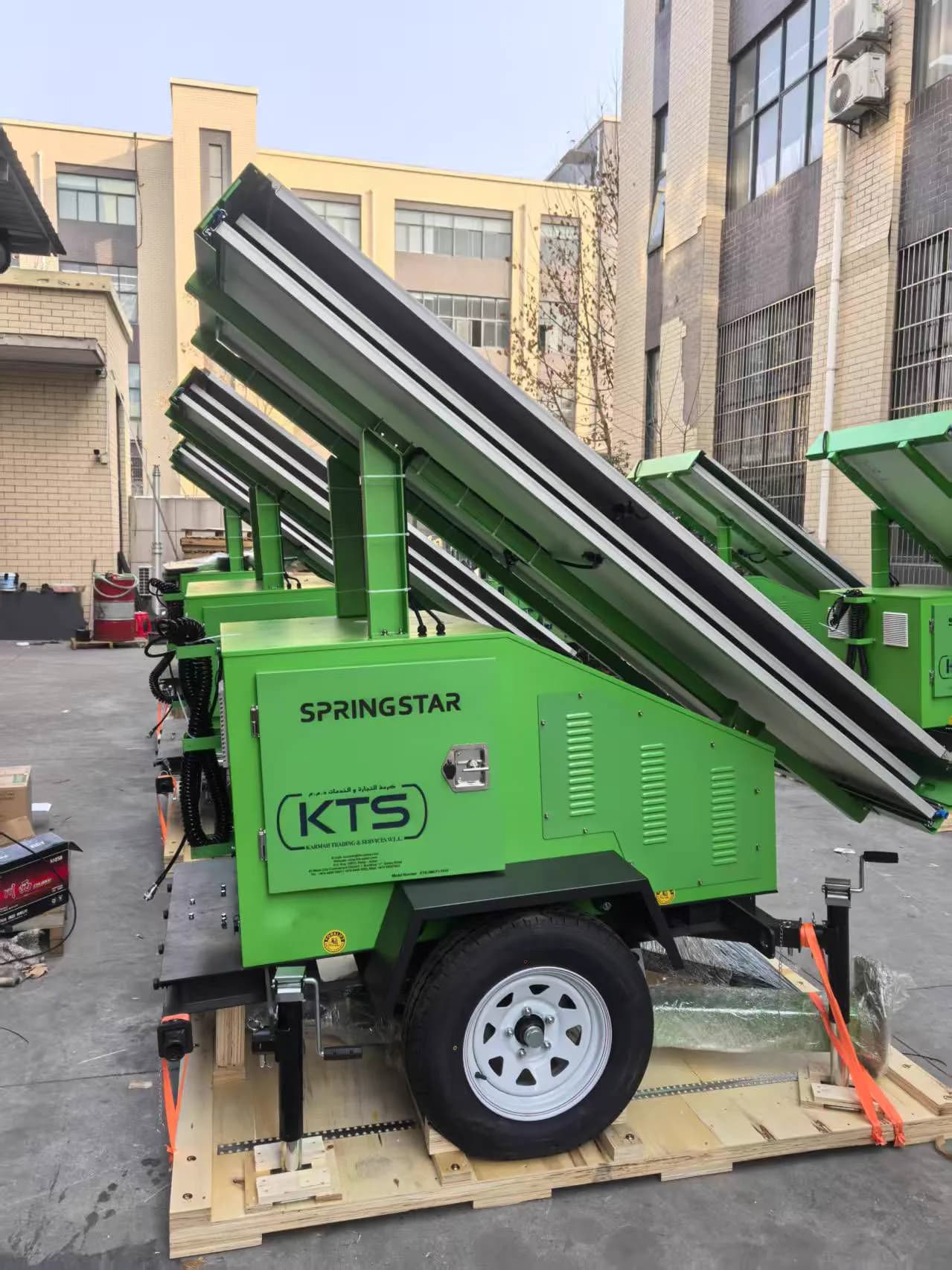KTS-branded mobile solar tower light on a road-towable trailer with folding photovoltaic panel arrays, ready for dispatch